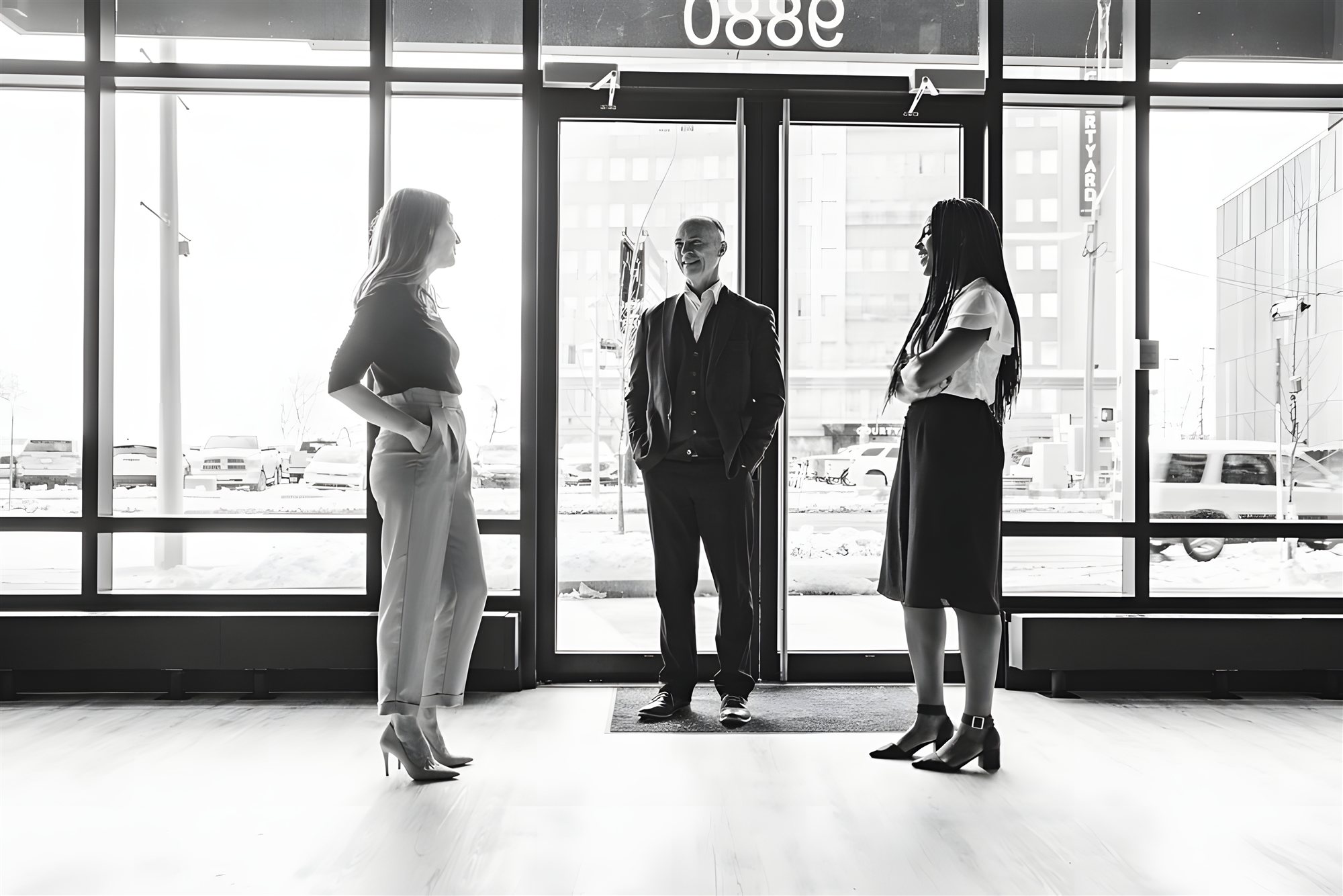 KRP staff at the Jasper Avenue entrance to the 9Triple8 Building