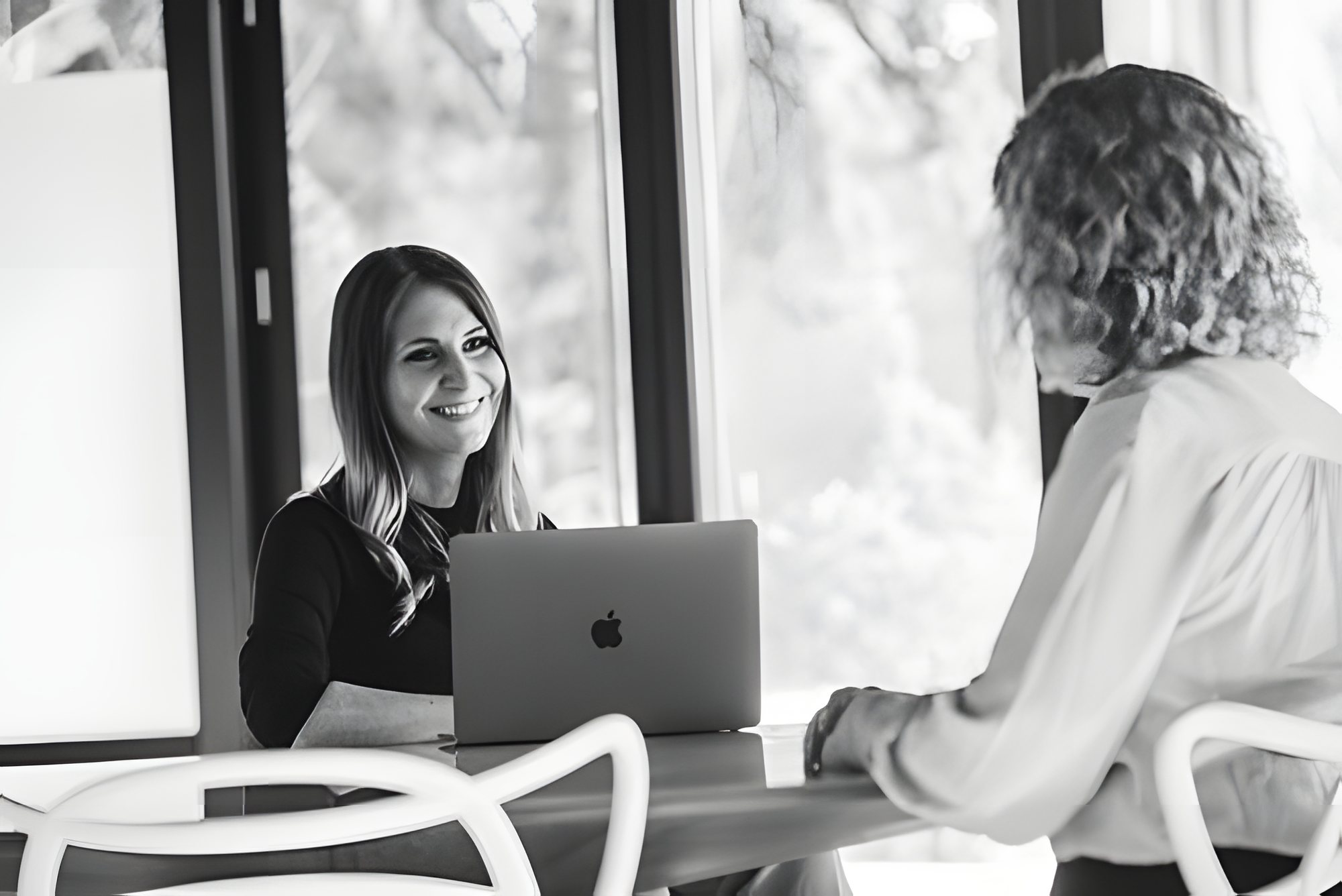 A KRP advisor meeting with a client across a table